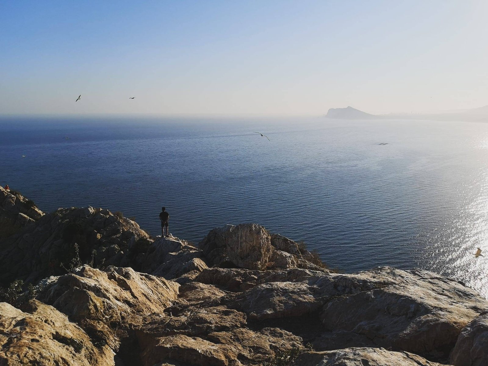 A man on top of Penon de Ifach