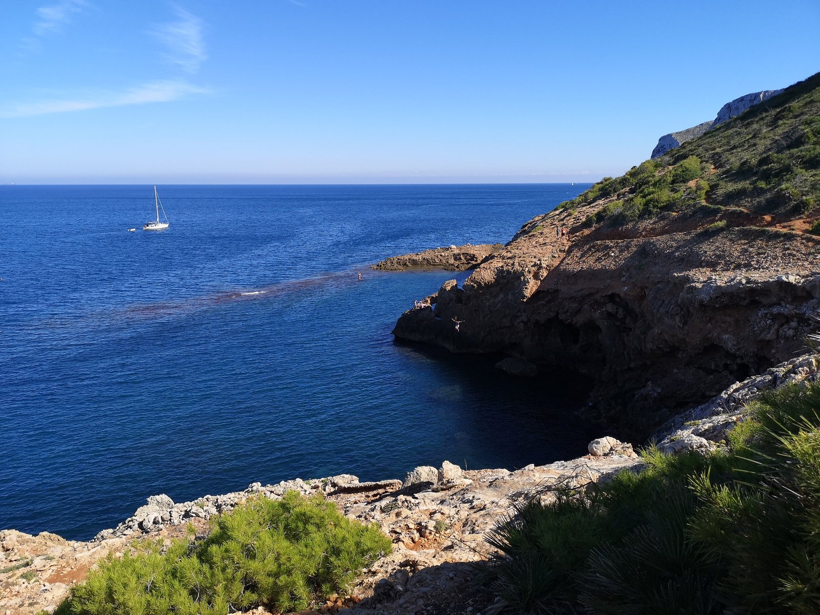 Cliff jumping near Cova Tallada in Costa Blanca, Spain