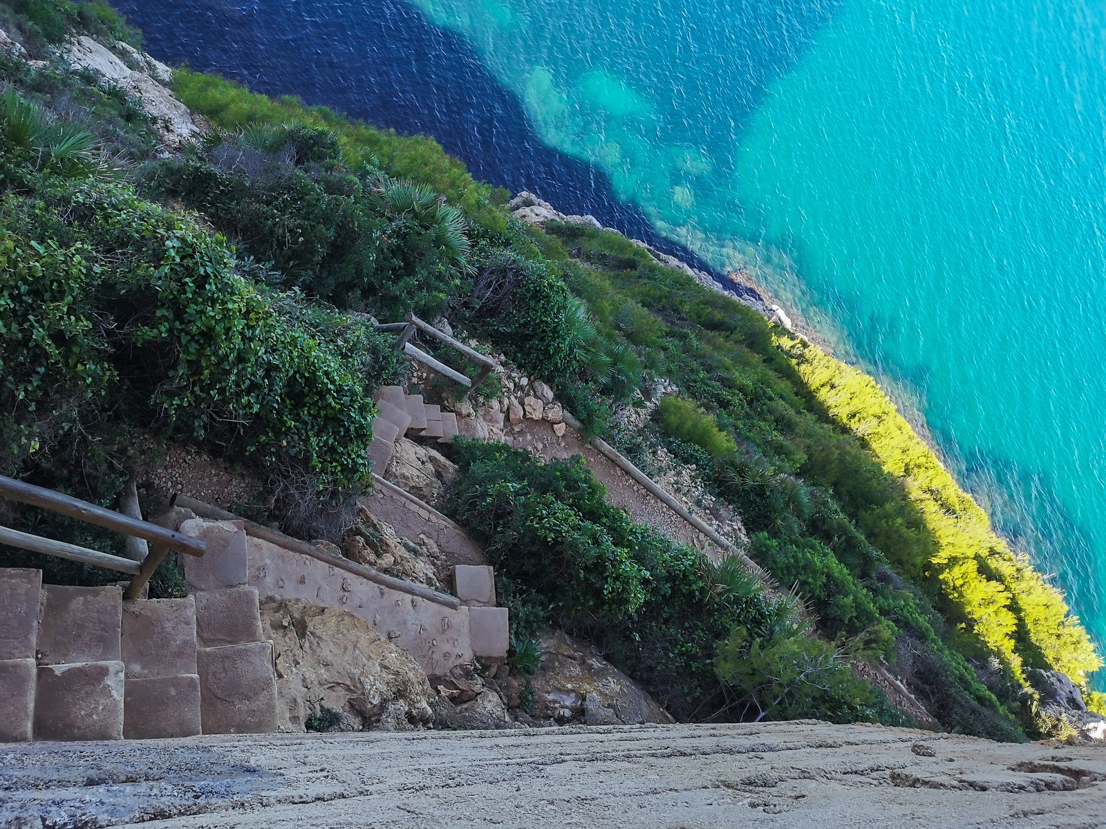 Steps on the yellow route from Denia to Cova Tallada, Costa Blanca, Spain