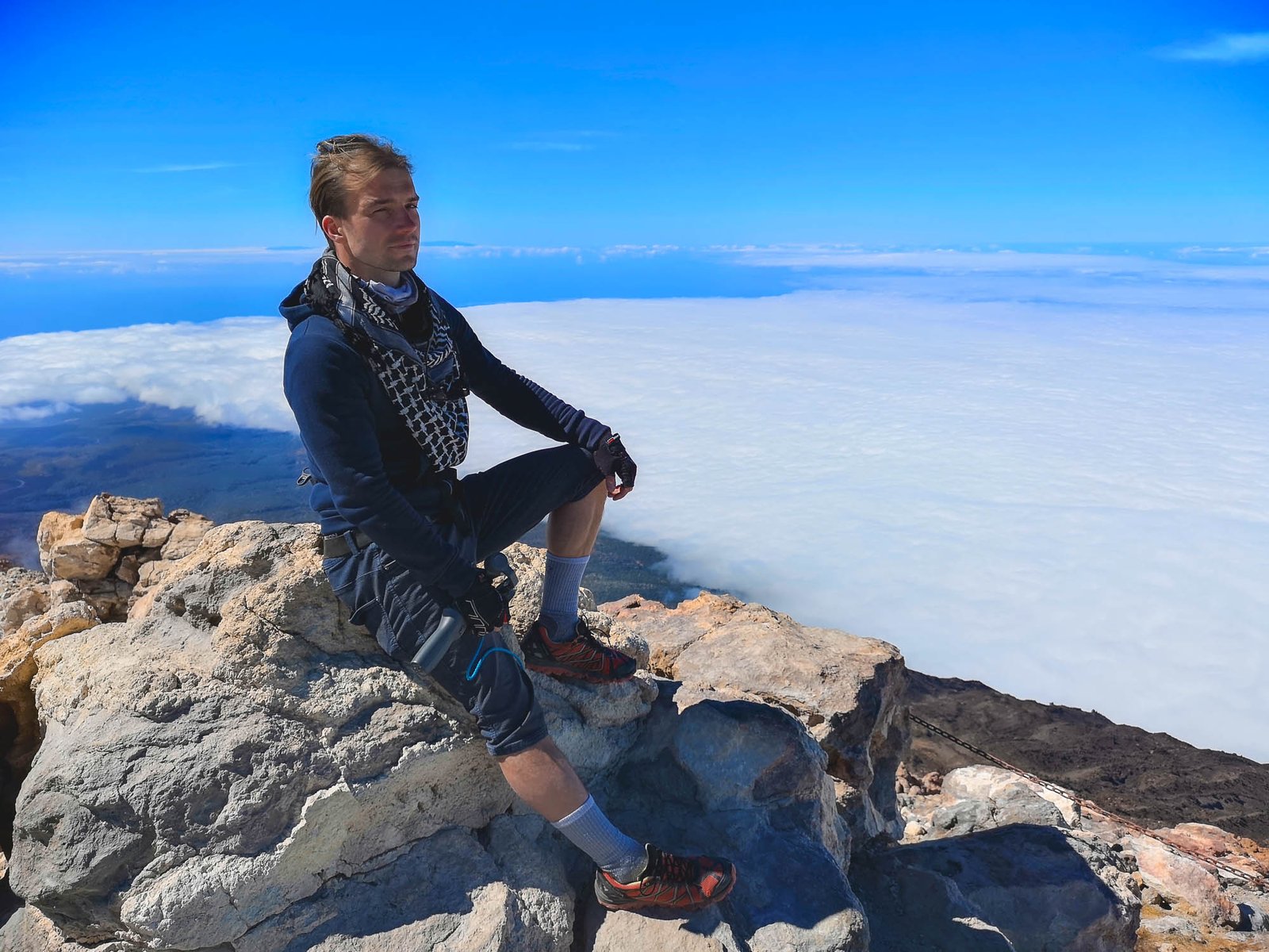 Man sitting on the top of Mount Teide, 3,718m