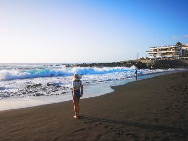 A woman on Tenerife beach during winter